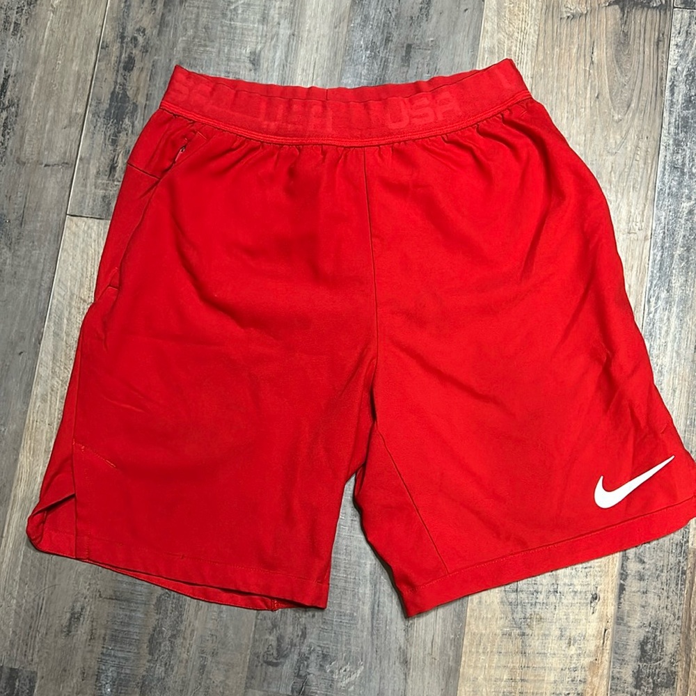 Red Nike Dri-fit shorts with pockets